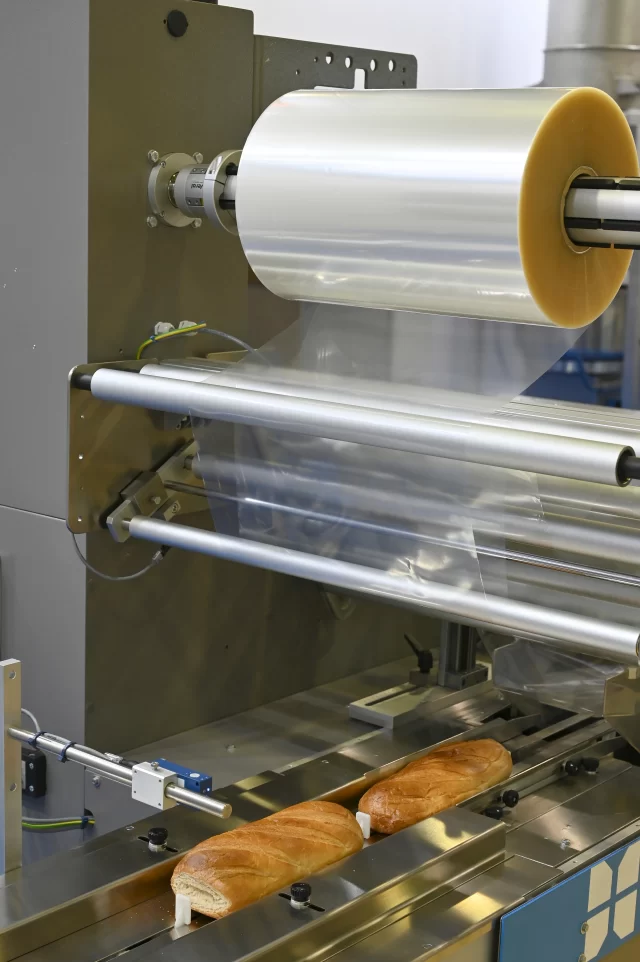 Custom Wholesale Polyethylene Tubing Roll placed on automatic packaging machine for food packaging