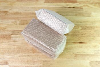 2 corrugated boxes sealed with bubble pouches